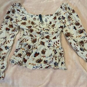 low v-neck, flowy, with flower designs